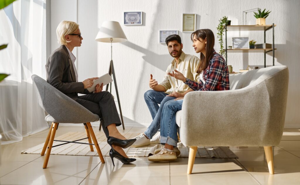 Couple arguing each other on therapy session