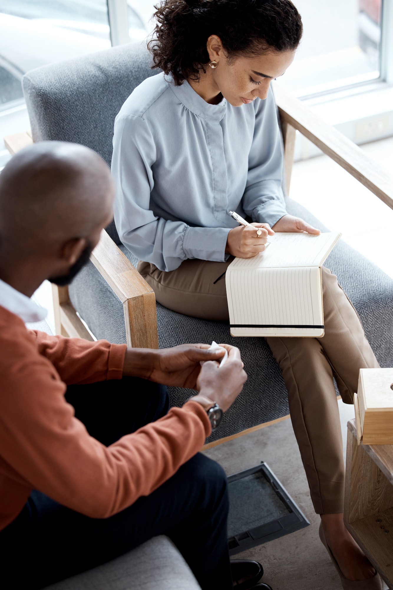 Therapy, counselling and writing notes of mental health conversation with patient and psychologist.